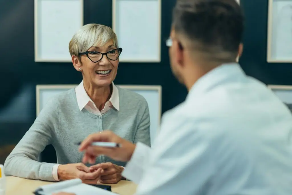 smiling-senior-woman-patiently-HR-counseling-a-male – United Outcomes – United Outcomes HR investigation interview