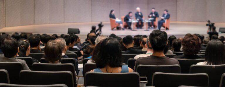 Rear view of the Audience is large enough for Martyn's law to apply in a conference hall or seminar meeting.